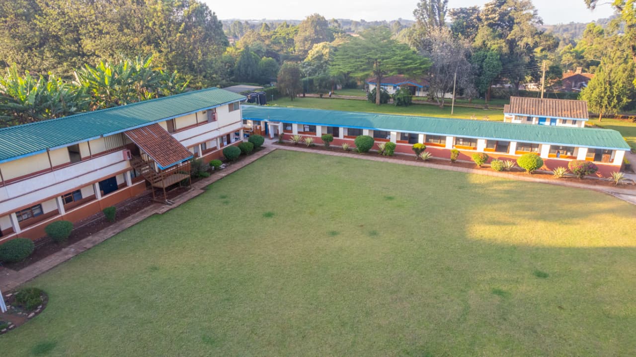 Students working on computers learning digital skills and coding in modern computer laboratory